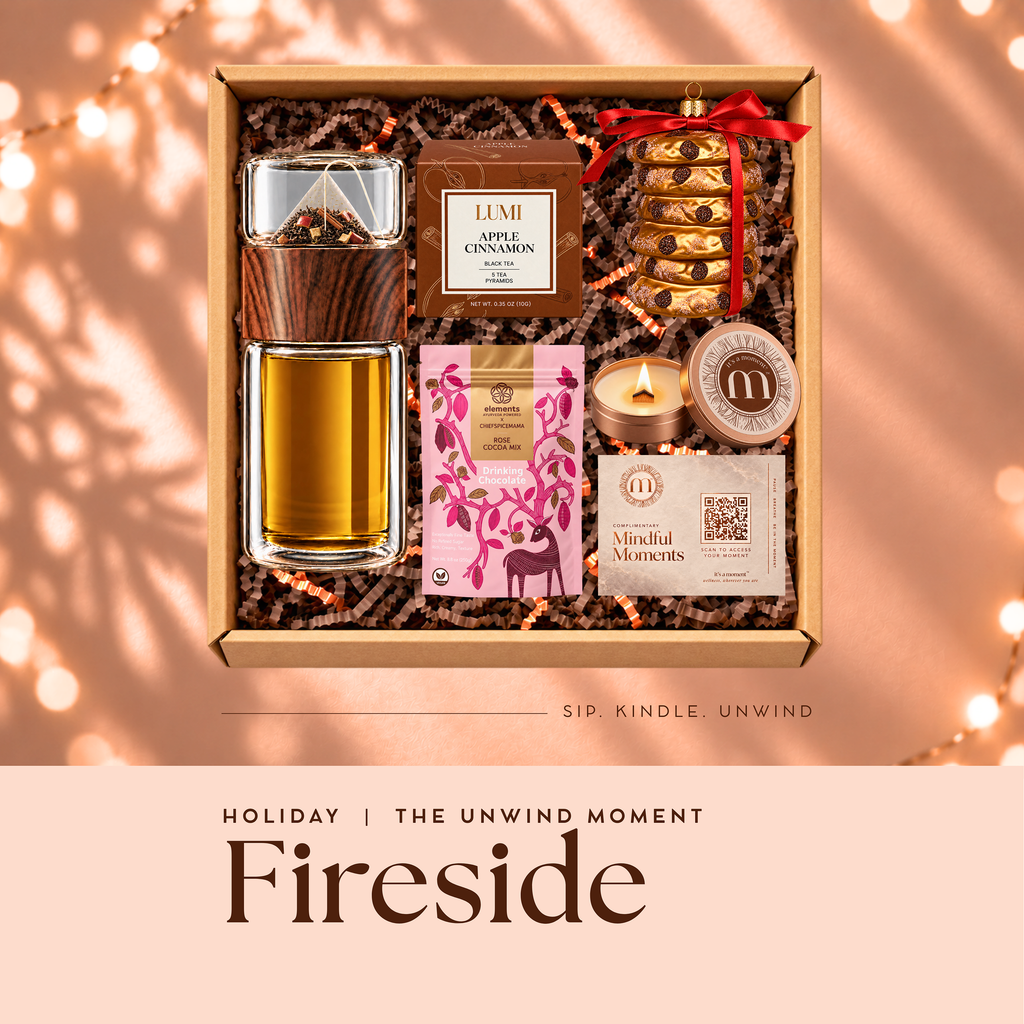 Fireside holiday engagement kit, open gift box with glass tea infuser, apple cinnamon tea, rose drinking chocolate, candle and cookie ornament
