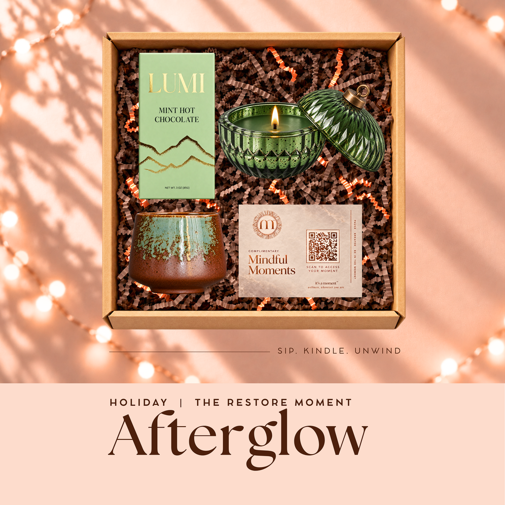Afterglow holiday engagement kit, open gift box with sipping mug, mint hot chocolate, evergreen ornament candle and Mindful Moments card