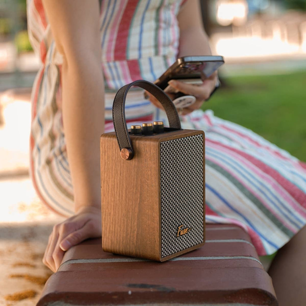 Fuse retro Bluetooth speaker in brown wood veneer with a vegan leather handle, view 3